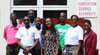 BHL's Corporate Comminications Manager Sophia Cambridge flanked by members of the Clean Bim Project team and officials of the Sanitation Service Authority.